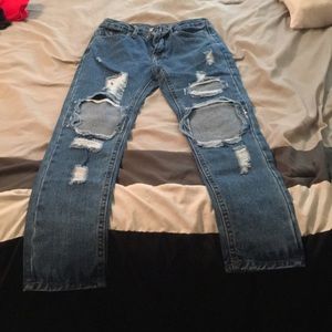 High waisted distressed blue jeans